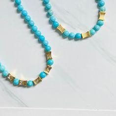 Our Antigua Turquoise Beaded necklace is a breath of fresh air, with brilliant blue hues that are reminiscent of the waters in Antigua. We're now offering in matte gold as well as shiny gold. Etched gold beads offer a striking contrast and we've added some chain so you can adjust the length. Necklace measures 18” in length with lobster clasp closure and is free from cadmium, lead, and nickel. Please note every batch of turquoise varies in color. Turquoise Beaded Necklace, Gold Beaded Necklace, Turquoise And Gold, A Breath Of Fresh Air, Turquoise Bead Necklaces, Length Necklace, Interior Design Business, Gold Bead Necklace, Breath Of Fresh Air