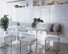 a white table and some chairs in a room