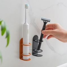 Description: Introducing our versatile and convenient wall-mounted electric toothbrush holder! Designed to fit a variety of surfaces such as tile, glass, marble, and wood, this toothbrush holder effectively prevents water and dust from entering the wall. Installation is a breeze - simply peel off the tissue paper on the back and stick it wherever you desire, no drilling or tools required. With this stick-on toothbrush holder, you can easily access your toothbrush and take out your electric tooth Bathroom Toothbrush Storage, Bathroom Toothbrush Organization, Tooth Brush Holder, Wall Mounted Toothbrush Holder, Toothbrush Organization, Electric Toothbrush Holder, Vintage Bathroom Decor, Toothbrush Holder Wall, Modern Bathroom Accessories