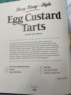 an egg custard tarts recipe book is open