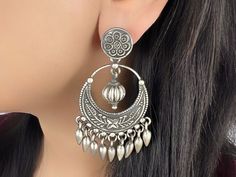 Beautifully handcrafted in Jaipur, these 925 sterling silver earrings have an excellent finish which gives out an exquisite sense of style. What's Included: 1 pair 925 Silver Earring Material: 92.5 Hallmarked Sterling Silver  Weight: 34.95 Grams Length: 2.8 Inches Width: 1.5 Inches Finish: Oxidized Silver  Nickel Free/Lead free This is handcrafted item: Our 92.5 hallmarked sterling silver jewelry is handmade by skilled artisans in Rajasthan, India using traditional,  centuries old jewelry making Sterling Silver Drop Earrings With Intricate Design, Handmade Sterling Silver Chandbali Danglers, Sterling Silver Temple Jewelry Earrings With Intricate Design, Sterling Silver Temple Jewelry Earrings With Oxidized Finish, Sterling Silver Oxidized Temple Jewelry Earrings, Oxidized Sterling Silver Temple Earrings, Sterling Silver Temple Jewelry Danglers, Sterling Silver Chandbali Earrings With Intricate Design, Sterling Silver Chandbali Danglers With Intricate Design