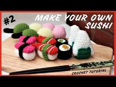 crochet sushi is on a cutting board with chopsticks