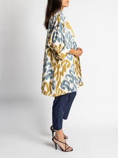 Our chic, oversized Florsana jacket was inspired by the caftan garments of Uzbek royalty and was designed with luxury and beauty in mind. This versatile piece is meant to be worn in place of a blazer and is perfect for travel. Shawl collar and shawl lapel Oversized fit flattering to all sizes 100% silk ikat fabric handwoven in Tashkent, Uzbekistan Tailored in Istanbul, Turkey Dry clean only One size fits most Model is 5'7" and wears size 4. Chic Long-sleeved Kaftan With Relaxed Fit, Chic Long Sleeve Kaftan With Relaxed Fit, Chic Long Sleeve Relaxed Fit Kaftan, Oversized Tunic Kaftan For Fall, Oversized Fall Tunic Kaftan, Tashkent Uzbekistan, Silk Ikat, Ikat Fabric, Oversized Jacket