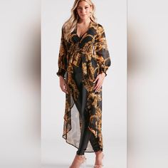 Show Off Your Bold Babe Status With This Eye-Catching And Chic Chiffon Duster. It Features A V-Neckline, A Smocked High Waist With A Partial Button-Down Front, Long Sleeves With Cinched Smocked Hems, And A Flowy High-Low Silhouette With A Ruffled Front Design. The Airy Chiffon Fabric Features A Chain-Link And Scroll Multi-Print Pattern. Layer Over A Bodysuit With Faux Leather Pants And Heels. Fit & Features V-Neckline Smocked High Waist, Button-Down Front Long Sleeves, Smocked Hems Flowy High-Lo Chiffon V-neck Blouse For Parties, Formal V-neck Chiffon Blouse, Formal Chiffon V-neck Blouse, Chic Chiffon Blouse For Night Out, Chiffon V-neck Party Blouse, Party V-neck Chiffon Blouse, Party Chiffon V-neck Blouse, Evening V-neck Chiffon Blouse, Floral Print Chiffon Blouse For Party