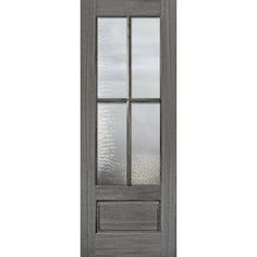 a gray door with glass panels on the top and bottom panel, in front of a white background