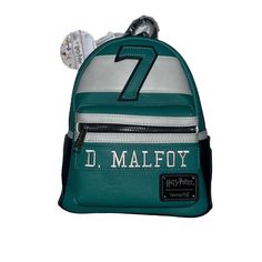 a green and white backpack with the number seven on it's front pocket, which reads d mallfoy