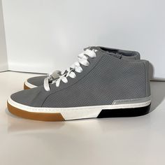 These Sneakers Are Brand New With Tags And Have Never Been Worn. These Sneakers Are Pretty Gray, Lace Up Sneaker. They Have A Perforated Detailing And A Zipper On The Inside Of The Shoe. Message Me With Questions! Gray High-top Sneakers With Perforations And Round Toe, Everyday Lace-up High-top Sneakers With Perforated Toe Box, Synthetic High-top Sneakers With Perforations, Everyday High-top Sneakers With Perforations, Gray Leather Ankle-high Sneakers, Gray Ankle-high Leather Sneakers, Trendy High-top Sneakers With Perforated Toe Box For Spring, Everyday High-top Sneakers With Perforated Toe Box, Everyday Synthetic Sneakers With Perforations