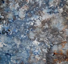 an abstract painting with blue, brown and white colors on the top part of it