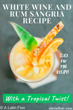 a white wine and rum sangria recipe with tropical twist in a small glass garnished with an orange slice