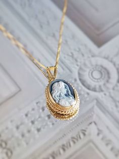 "Featuring a blue agate cameo necklace framed with a golden silver sterling 925 textured frame and chain. ✨ design: Charming white young lady surrounded by long loose hair on a blue background. Shape: Oval. Very charming and elegant, the perfect gift any woman would like to receive. Silver sterling 925 *available also with a silver frame. View \"Cameo Necklaces\" section in shop! ➳Agate is a variety of banded Chalcedony, which is a variety of the mineral Quartz, known for helping you express you Intaglio Pendant Necklace For Wedding, Wedding Cabochon Medallion Necklace, Blue Cameo Necklace For Wedding, Blue Cameo Jewelry For Wedding, Blue Cameo Necklace For Formal Occasions, Blue Cameo Jewelry For Formal Occasions, Sterling Silver Cameo Jewelry For Gift, Elegant Cameo Locket Necklace For Wedding, Victorian Blue Cameo Jewelry