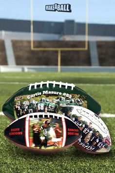 two footballs sitting on top of a green field