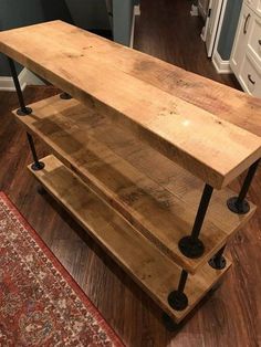 a wooden table sitting on top of a hard wood floor