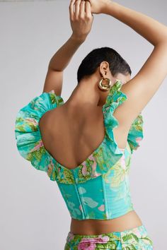 The Azra Teal Corset Top is from the Resort'24 collection and is made from lightweight breathable cotton linen. Exuding a cheerful resort aesthetic, the top has a femininely chic corset-style bodice, with a frilled playful neckline, and the darling floral print adds a pinch of tropical sass to the style. The fitted top features a curved hem and has a zipper fastening. Best paired with the Azra Maxi Skirt, and you're set to sip cocktails by the pool. Teal Corset, Resort Aesthetic, Fitted Top, Corset Style, Corset Top, Cotton Linen, Maxi Skirt, Bodice, Floral Print