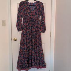 Gorgeous, Comfy Maxi Dress With Long Sleeves, Smocked Waistline, And Ruffled Hem. V Neck With A Hook And Eye Closure So You Can Wear It Open Or Closed. Red Floral Pattern On Navy Blue Background With Touches Of Gold. Tags Still Attached! Please Note, This Is A Petite Medium. I Am About 5' 5" And It Hits Right Above My Ankles. Pit To Pit 16" Shoulder To Hem 49" Sleeves From Shoulder 20.5" Casual Blue Boho Dress For Fall, Fitted Long Sleeve Cotton Boho Dress, Comfy Maxi Dress, Maxi Dress With Long Sleeves, Petite Maxi Dress, Red Floral Pattern, Boho Floral Maxi Dress, Navy Blue Background, Dress With Long Sleeves