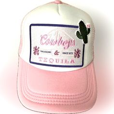 This Is My “Basic” Trucker Hatpink/White Trucker Hat With 2 Amazing Quality Patches. The 4” Patch Is Trimmed With Blue And It Reads “ Cowboys & Tequila The Legend Since 1873”. The Smaller Patch Is A Green Cactus With Pink Bloom. Very Trendy! If You Would Like Additional Patches Or Accent Pieces, Send Me A Message For Further Designing Options. Trucker Hats With Patches, Trendy Trucker Hats, White Trucker Hat, Green Cactus, Country Concert, Cow Girl, White Mesh