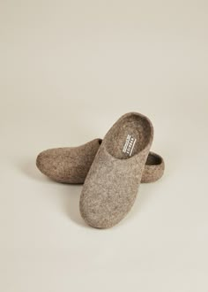 • If you are between sizes, we suggest sizing up• Felted wool slippers• Grippy, sustainable silicone indoor sole• Hassel-free low back for easy slipping on and off• Handmade in Kyrgyzstan For a more narrow fit, we suggest this style. Also available in women's sizes. Kyrgies Classics are handcrafted in Kyrgyzstan by women artisans using a traditional felting technique that is centuries old. The cozy, sustainably felted wool makes this pair of house shoes the ultimate hygge accessory for any seaso Felted Wool Slippers, Handwritten Gifts, Wall Decor Storage, Wool Slippers, Vegan Gifts, Quick Gifts, Cozy Gift, Backpack Travel Bag, House Shoes