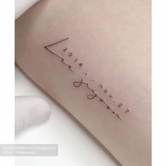 a small tattoo on the back of a woman's arm that says, i love you