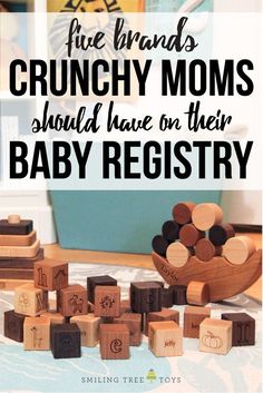 a pile of wooden blocks with the words, five brands crunchy moms should have on their baby registry