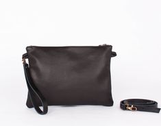 Small leather bag, leather crossbody bag, sister gift, black crossbody bag, black leather bag, black leather purse, leather clutch, travel bag HANDMADE BLACK LEATHER BAG - The small leather bag HIBRID is characterized by its hand crafted and material quality and locally sourced. Small crossbody cow leather ( soft anf hight quality) handmade designed. It has an interior pocket smartphone size, stitching for the inside pocket shows on the outside. Without linning. Clousure with black metalic Zippe Black Leather Evening Bag With Adjustable Strap, Black Crossbody Clutch For Daily Use, Black Leather Clutch Evening Bag, Daily Use Black Crossbody Clutch, Black Soft Leather Bag As Gift, Black Soft Leather Crossbody Clutch, Black Leather Clutch For Daily Use, Black Leather Pouch Clutch, Gift Black Clutch Shoulder Bag