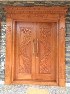 a wooden door with carvings on the front and side panels inlayed to it