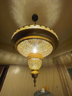 a chandelier hanging from the ceiling in a room