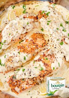 fish covered in white sauce and garnished with parsley next to a can of doughnuts