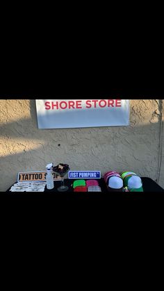 there is a sign that says shore store on the wall next to some other items