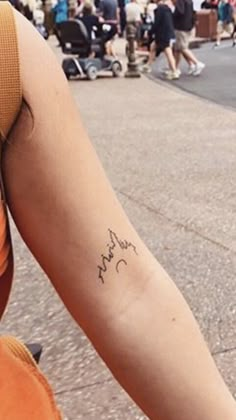 a person with a small tattoo on their arm