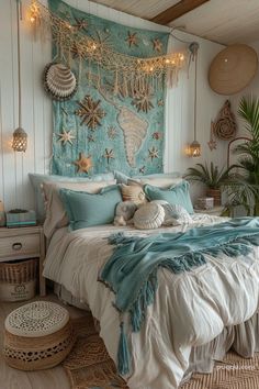 a bedroom decorated in blue and white with starfish decorations on the wall above the bed