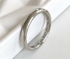 a wedding band with the words, i love you to the moon and back engraved on it