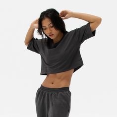 The Easy Crop Top is a must-have essential in your wardrobe. You will love our lightweight organic cotton crop top, which is perfect for your everyday basics. This piece is such a staple throw on our matching comfy sweats for a flawless street look or pair it with your favourite leggings or jeans. Ideal for in the gym and out on the streets. Made from our lightweight organic cotton. 95% organic cotton, 5% Elastane. Dyed with certified Eco-Friendly dyes. GOTS & OEKO-TEX® approved. All packaging is recycled or responsibly sourced. Cotton Athleisure Cropped T-shirt For Workout, Versatile Relaxed Fit Activewear For Everyday, Basic Cotton Crop Top For Workout, Basic Cropped T-shirt For Loungewear, Soft-washed Athleisure Top, Comfortable Relaxed Fit Workout Tops, Athleisure Crop Top T-shirt For Loungewear, Cotton Cropped T-shirt For Loungewear, Basic Crop Top For Loungewear