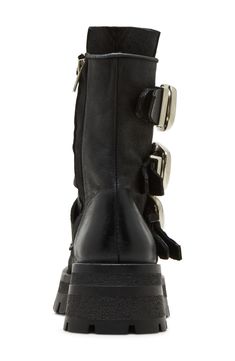 Bring a bit of moto edge to your everyday style in this lug-sole bootie accented with a trio of bold buckle straps. 2 1/4" heel 6 3/4" shaft Side zip closure Leather upper/synthetic lining and sole Imported Edgy Heeled Boots With Buckle Closure And Round Toe, Edgy Calf Leather Moto Boots, Fall Calf Leather Moto Boots With Buckle, Punk Moto Boots With Buckle Closure For Fall, Punk Moto Boots With Buckle For Fall, Punk Style Moto Boots With Buckle For Fall, Edgy Leather Moto Boots With High Ankle, Edgy High Ankle Leather Moto Boots, Edgy Fall Boots With Buckle Closure