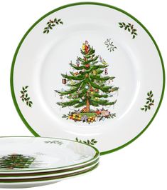 a christmas tree plate with green trimmings on the side and two plates in front