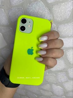 a woman's hand holding an apple phone case