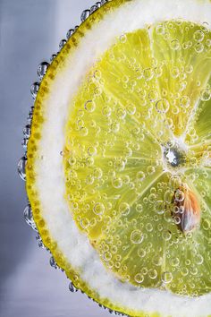 a slice of lemon with bubbles on it