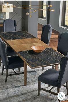 An exquisite statement piece, the Noir Porcelain Butterfly Dining Table is a contemporary addition to any refined abode. Showcasing a unique black porcelain top and beechwood straight legs, this stylish dining table has an eye-catching appeal, perfect for those who appreciate sophisticated, modern designs. Able to expand and seat up to 12 people, this extendable table brings luxury and convenience to any gathering. #modern, #diningtable