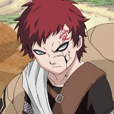 an anime character with red hair and green eyes looking at the camera while standing in front of sand