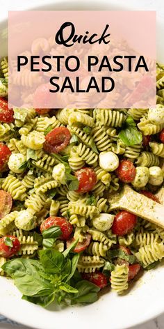 pasta salad in a white bowl with the words quick pesto pasta written above it