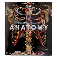 the book anatomy is on display in front of a white background with an image of a human