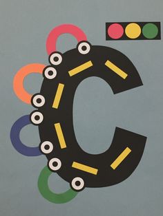 the letter c is made up of different colored circles