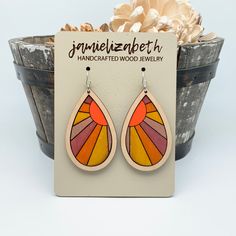 Add a touch of whimsy with these painted sunset teardrop earrings. The hand painted sunset design on wood creates a unique and playful look. Perfect for any occasion, these earrings will surely make a statement. Choose your size and wood to make them your own! Earrings and necklaces are made to order with love. Please allow at least 7-10 business days for your special pair to be made! But we will get your #pinkmail to you as soon as possible! Large: 2.2in Medium: 1.6in *Hooks are nickel free and Painted Sunset, Sunset Design, Sunset Painting, Handcrafted Wood, Large Earrings, The Hand, Wood Jewellery, Teardrop Earrings, With Love