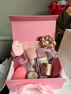 a pink box filled with lots of different items