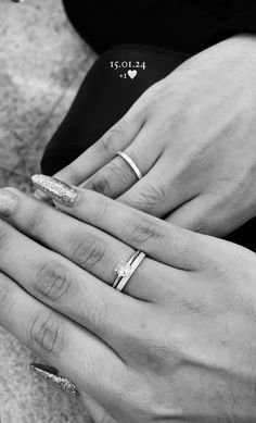 two people with wedding rings on their hands