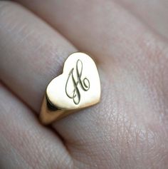 The heart signet ring is a classic, and this one is personalized with an inset monogram. This item is engravable with text or monogram of your choice at no extra cost. The initals are engraved onto the ring and embedded in the 3D model for a flawless embossed finish. You may choose to customize this ring with different images, letters or words. A render of your custom design will be sent to you before production. A gemstone on this ring is also possible, please inquire for pricing details and op Classic 14k Gold Initial Ring For Personalized Gift, Monogrammed Yellow Gold Rings As Personalized Gift, Personalized Initials 14k Gold Rings, Personalized 14k Gold Rings With Initials, Minimalist Signet Ring With Initials For Wedding, Personalized 14k Gold Heirloom Initial Ring, Personalized Silver 14k Gold Heart Ring, Personalized 14k Gold Silver Heart Ring, Personalized Silver Heart Ring In 14k Gold