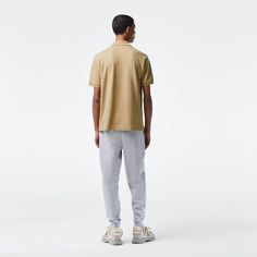 Lacoste Classic polo shirt.Beige cotton.100% cotton.Logo appliqué, ribbed trims.Machine wash Sporty Polo Shirt With Relaxed Fit, Sporty Relaxed Fit Polo Shirt, Cotton Polo Shirt With Ribbed Collar, Casual Collared Polo Shirt For Streetwear, Cotton Polo Shirt For Streetwear, Cotton Collared Polo Shirt For Streetwear, Lacoste Men, Cotton Polo Shirt, Classic Logo