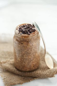 a glass jar filled with oatmeal and chocolate chips