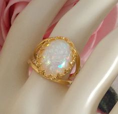 Stunning Vintage Opal Gold Filled Dress Ring Ring size R  - the inside diameter of the ring band is 1.86 cm across (this is a large ring size) The beautiful Opal is 1.7 cm long and 1.2 cm wide and sits 8 mm high and is securely claw set Stamped S925. Total weight is 4.40 grams A stunning Cocktail Ring, in excellent condition, with minimal wear Box for display purposes only Customs and import taxes Buyers are responsible for any customs duties and import taxes charged by their respective Governme Cabochon Opal Open Ring For Anniversary, Open Ring Opal Cabochon For Anniversary, Open Opal Ring With Cabochon For Anniversary, Cabochon Open Ring For Anniversary, Cabochon Rings For Anniversary, Deco Dress, Art Deco Dress, Large Ring, Dress Rings