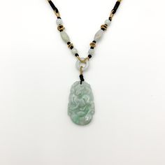 This is a high grade jadeite jade pendant necklace. It is exquisitely hand carved, so each pendant is different in some way. The pendant is completely natural jade, un-dyed and in its natural form. The pendant is carved in the form of the Chinese Zodiac - Dog. The beads above the pendant on the necklace are natural hand carved jadeite jade beads. They may not be perfectly round because they are hand carved. This gives the necklace a more rustic and natural stone like look. The years of the Dog i Carved Jade Pendant Necklace, Carved Jade Pendant Jewelry, Carved Jade Jewelry For Good Luck, Carved Oval Jade Jewelry, Oval Carved Jade Jewelry, Dog Chinese Zodiac, Red Pendant Necklace, Red Pendant, Jade Pendant Necklace