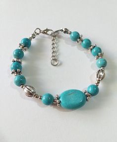 Turquoise silver bracelet Victorian bracelet Royal style bracelet Turquoise Antique style bracelet boho bracelet bohemian bracelet wife gift Turquoise bracelet Royal style bracelet Antique style bracelet Victorian filigree silver tone large oval Turquoise and round Tibetian turquoises and silver tone beads Unique bracelet . Silver-tone bracelet . Gemstone Boho bracelet . Bohemian bracelet . Vintage style bracelet. Antique style bracelet . Oriental style Princess style bracelet. Edwardian style bracelet. Turquoise jewelry. This bracelet is adjustable with plus 3.5 cm chain . For any size. We have a jewelry set earrings and necklace matching with this bracelet in that  listing. https://www.etsy.com/listing/1216660856/turquoise-set-silver-jewelry-set?click_key=9be094aefd185b7e21933578ba08fe62 Turquoise Bracelet With Silver Beads, Bohemian Turquoise Beaded Bracelets With Silver Beads, Bohemian Turquoise Beaded Bracelet With Silver Beads, Handmade Round Turquoise Bracelets, Bohemian Turquoise Beaded Nickel-free Bracelets, Bohemian Bracelets With Silver Beads, Bohemian Turquoise Bangle Bracelets, Bohemian Turquoise Beaded Nickel Free Bracelets, Bohemian Turquoise Beaded Bracelets Nickel Free