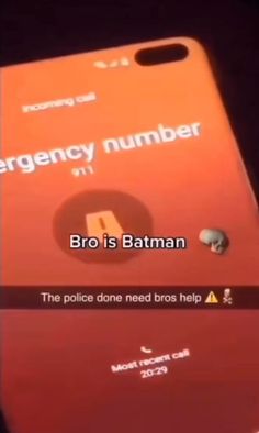 an emergency number on the back of a red cell phone with text reading,'bro is batman the police done need bros help '